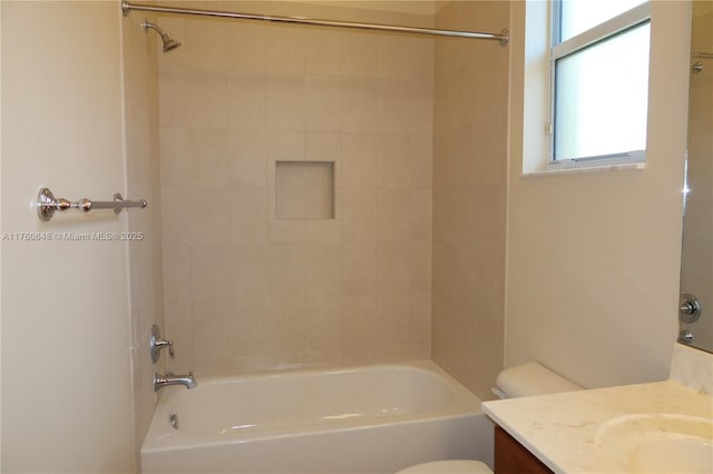 full bath with toilet, vanity, and  shower combination