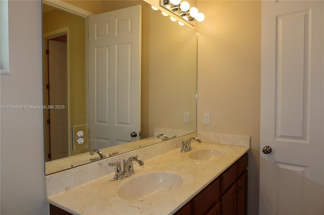 full bath with double vanity and a sink