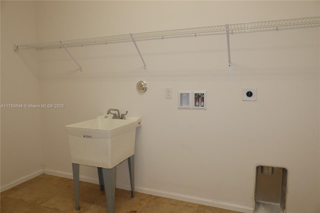 washroom featuring washer hookup, laundry area, baseboards, and electric dryer hookup