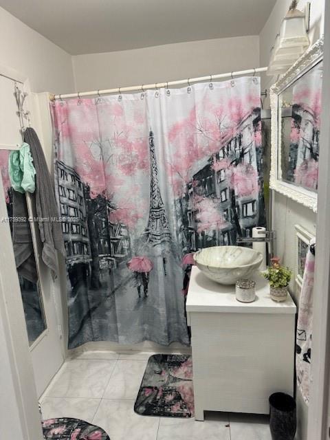 bathroom with tile patterned flooring and vanity