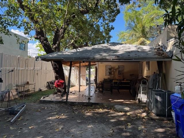 back of house with a patio area and fence