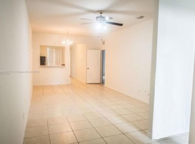 unfurnished room featuring a ceiling fan