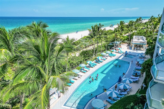 bird's eye view featuring a water view and a view of the beach