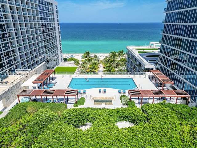 exterior space featuring a view of the beach and a water view