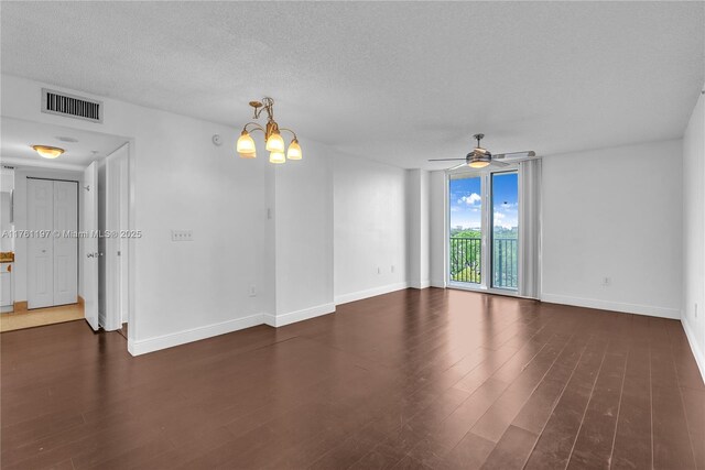 520 SE 5th Ave Unit 1507, Fort Lauderdale, FL 33301 - spare room featuring dark wood finished floors, a ceiling fan, a textured ceiling, and a chandelier