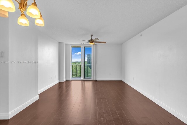 520 SE 5th Ave Unit 1507, Fort Lauderdale, FL 33301 - empty room with ceiling fan, a chandelier, and dark wood-style floors