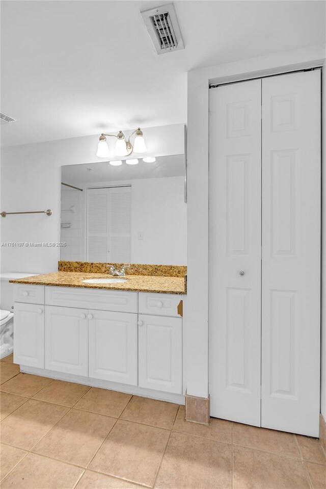 520 SE 5th Ave Unit 1507, Fort Lauderdale, FL 33301 - bathroom featuring a closet, vanity, and tile patterned flooring