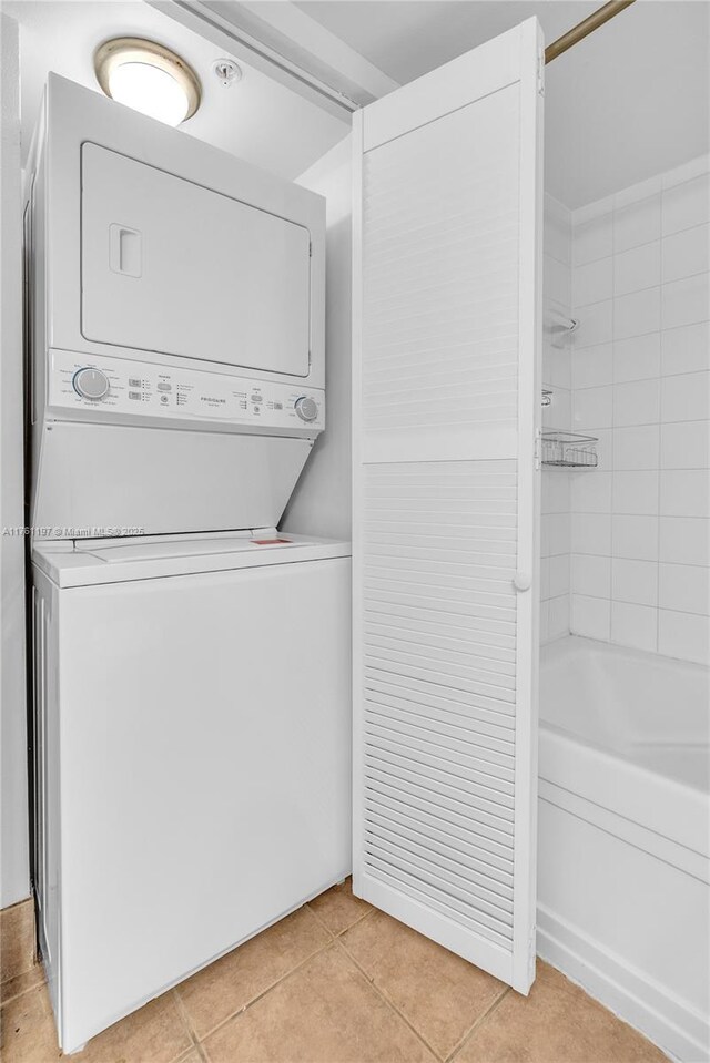 520 SE 5th Ave Unit 1507, Fort Lauderdale, FL 33301 - laundry room featuring stacked washing machine and dryer and light tile patterned flooring