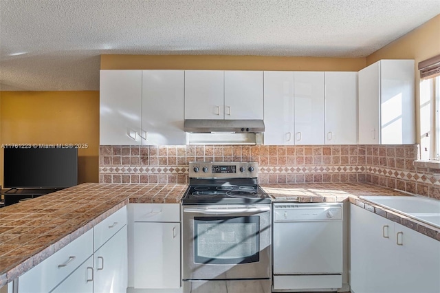 kitchen featuring dishwasher, white cabinets, under cabinet range hood, and stainless steel range with electric cooktop