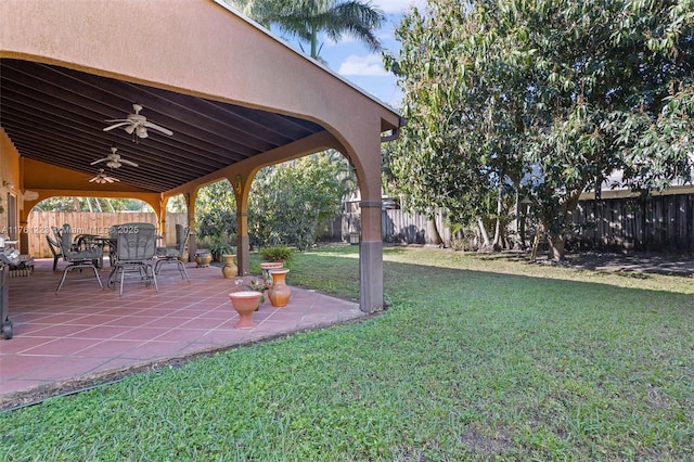 view of yard with a patio, a fenced backyard, and ceiling fan