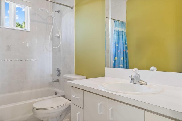 full bathroom with vanity, toilet, and shower / tub combo with curtain