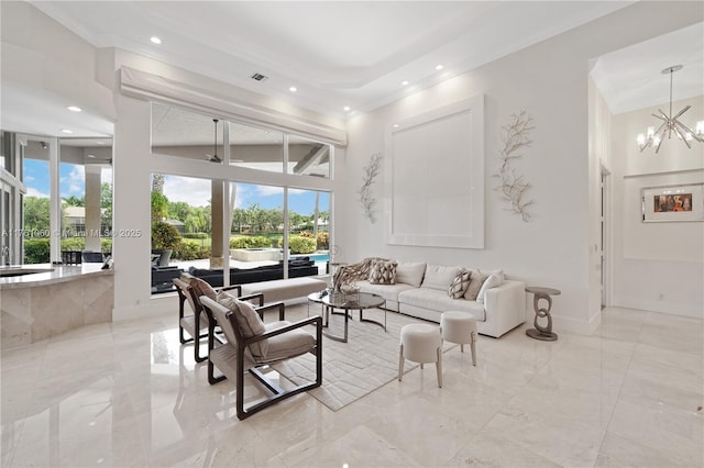 living area with baseboards, recessed lighting, an inviting chandelier, a towering ceiling, and marble finish floor