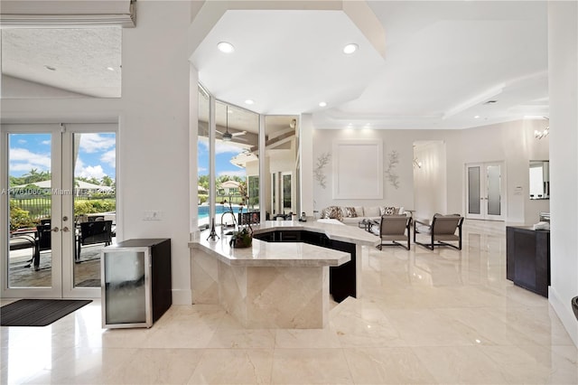 interior space featuring recessed lighting, marble finish floor, french doors, and baseboards