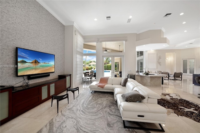 living room featuring visible vents, an accent wall, recessed lighting, french doors, and marble finish floor