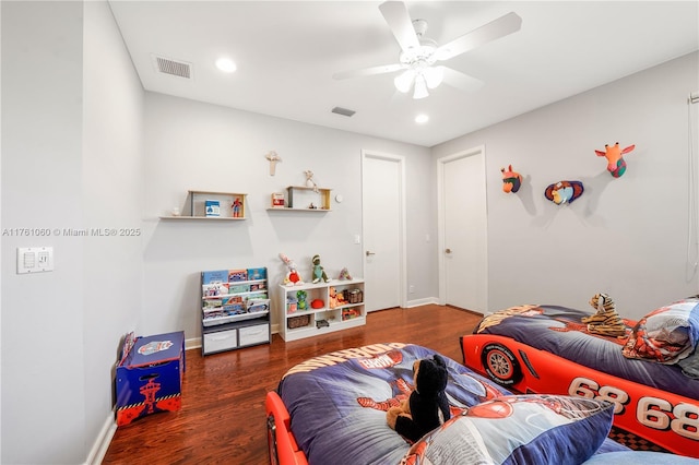 bedroom with visible vents, baseboards, a ceiling fan, and wood finished floors