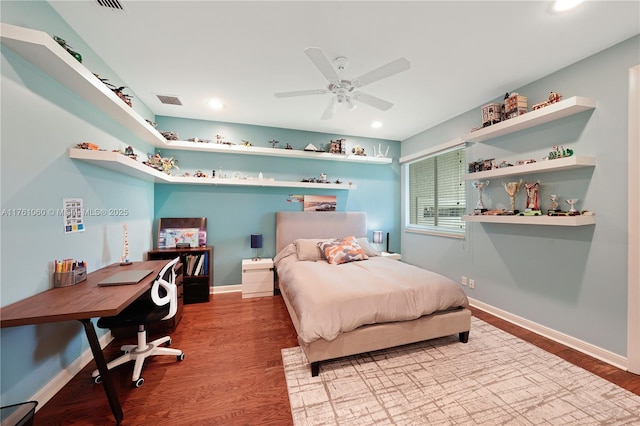 bedroom with recessed lighting, baseboards, and wood finished floors