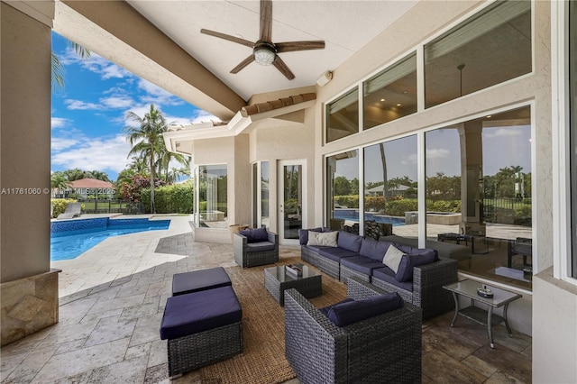 view of patio with an outdoor pool, outdoor lounge area, a ceiling fan, and fence