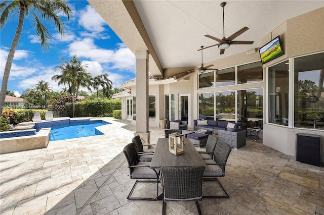 view of swimming pool featuring ceiling fan, an outdoor hangout area, a patio, and a fenced in pool