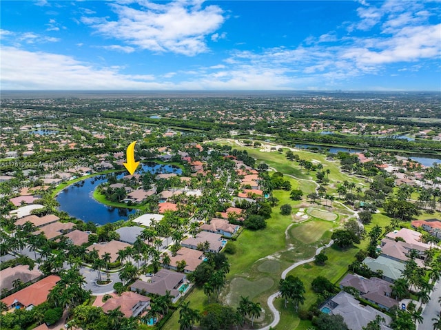 aerial view with golf course view, a water view, and a residential view