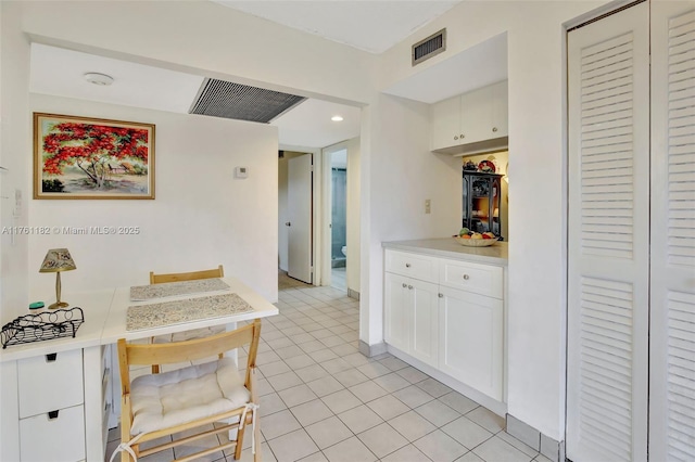 1001 Colony Point Cir Unit 514, Pembroke Pines, FL 33026 - kitchen featuring white cabinets, light tile patterned floors, and light countertops
