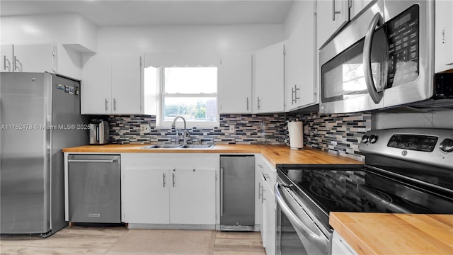 3349 W Park Rd, Hollywood, FL 33021 - kitchen with tasteful backsplash, butcher block countertops, stainless steel appliances, and a sink