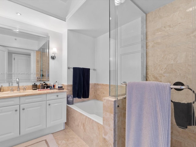 bathroom featuring a garden tub, ornamental molding, vanity, and a tile shower