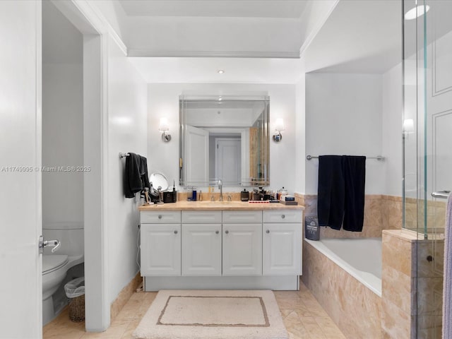 bathroom with tile patterned floors, toilet, a bathing tub, walk in shower, and vanity