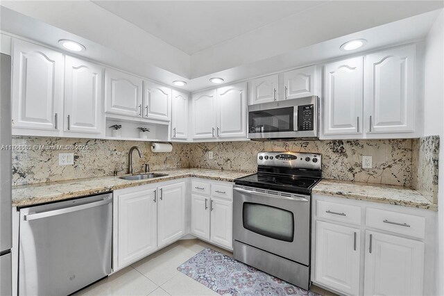 full bath with a stall shower, toilet, vanity, and recessed lighting