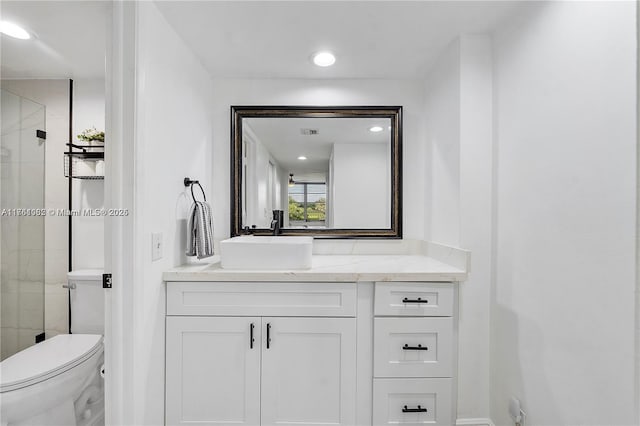 bathroom with visible vents, vanity, toilet, and a shower stall