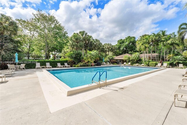 pool with a patio area