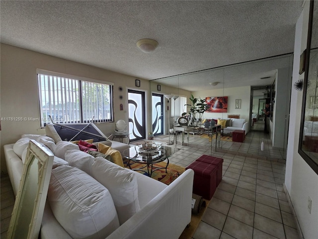 tiled living room with a textured ceiling