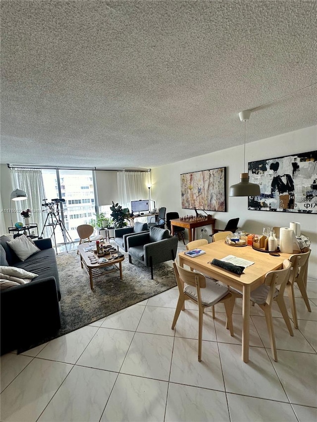 dining space featuring a textured ceiling and floor to ceiling windows