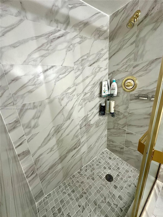 full bathroom with tiled shower