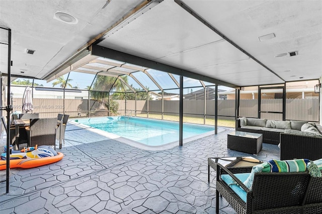 view of swimming pool with a lanai, a patio, a fenced backyard, and an outdoor hangout area