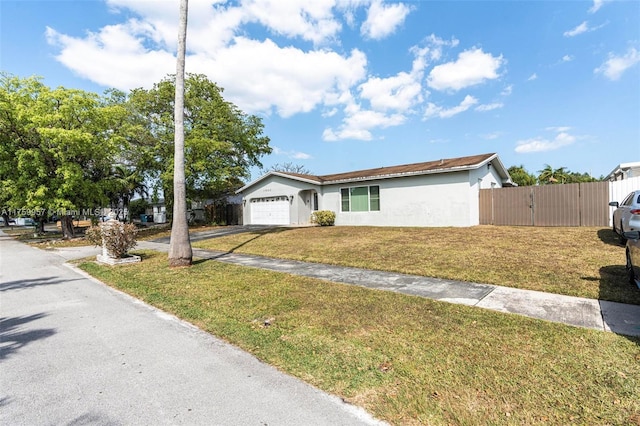 single story home featuring a front yard, a gate, fence, stucco siding, and a garage