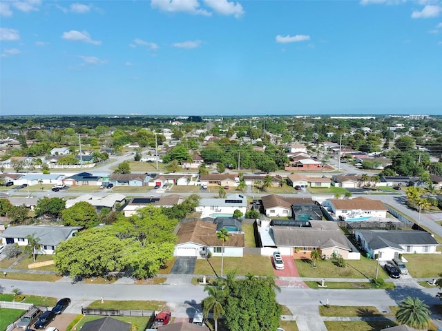 birds eye view of property with a residential view