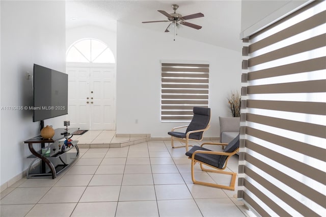 entrance foyer with baseboards, high vaulted ceiling, a ceiling fan, and tile patterned flooring