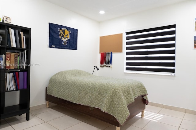 tiled bedroom featuring recessed lighting and baseboards