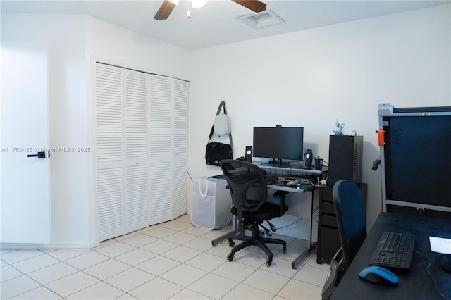 office space with tile patterned floors and ceiling fan