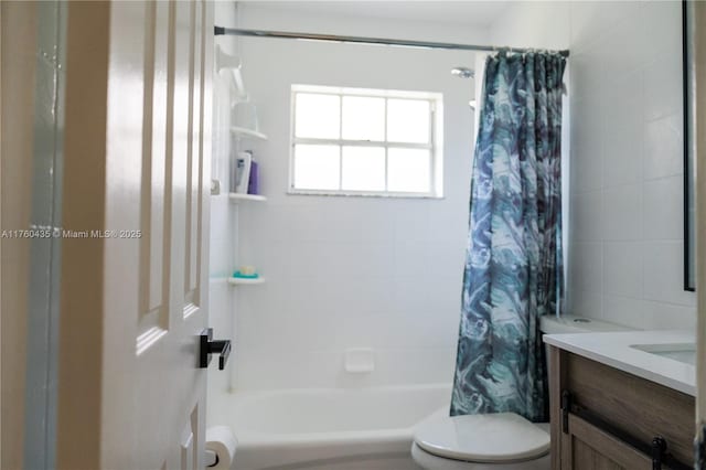 bathroom featuring vanity, toilet, and shower / tub combo