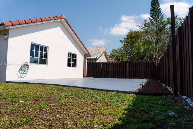 view of yard with a patio area and fence private yard