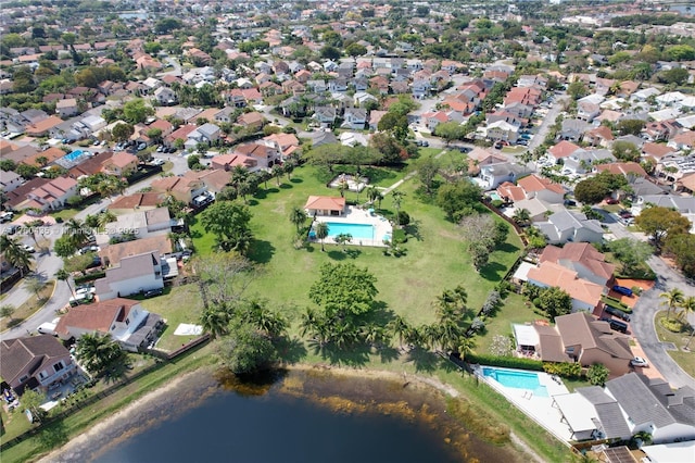 bird's eye view featuring a residential view and a water view