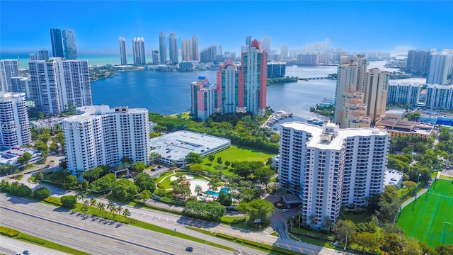 bird's eye view featuring a water view and a city view