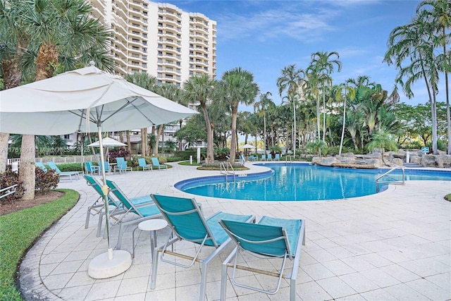 community pool with a patio area