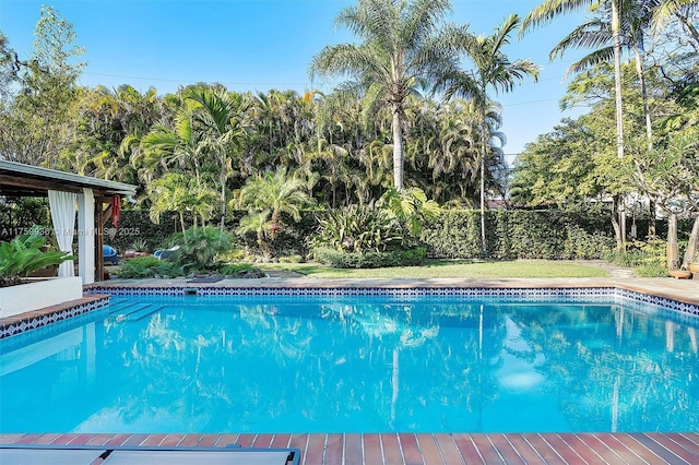 view of swimming pool with a fenced in pool
