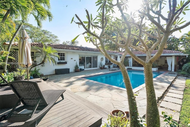 outdoor pool featuring a deck