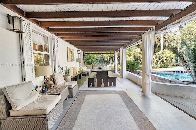 view of patio / terrace with an outdoor living space and an outdoor pool