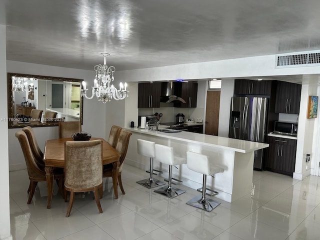 dining room featuring a notable chandelier, visible vents, and light tile patterned flooring