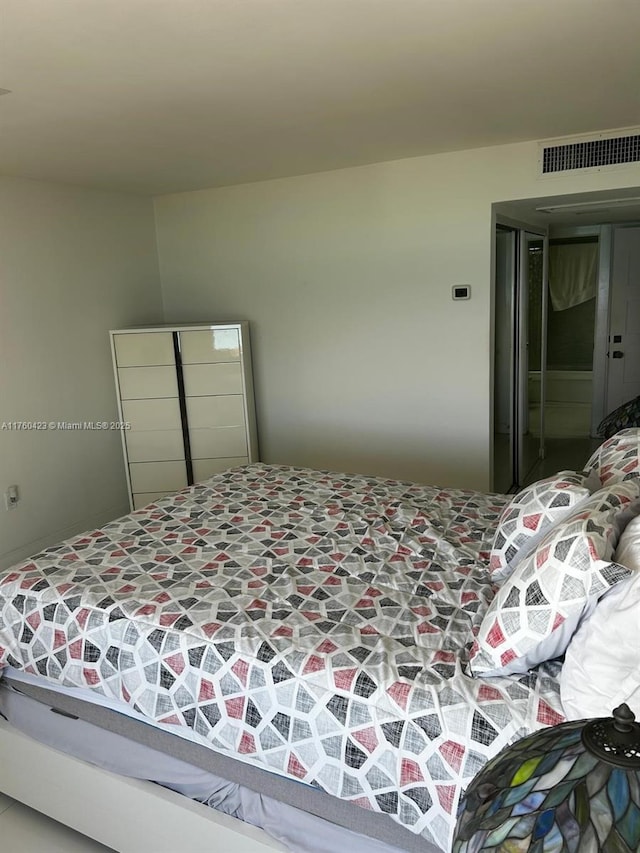 bedroom featuring visible vents