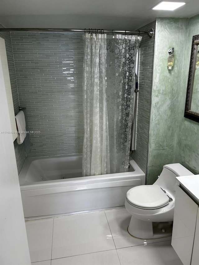 bathroom featuring vanity, tile patterned floors, toilet, and shower / bath combo